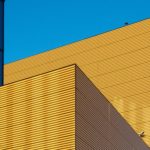 Yellow building against blue sky
